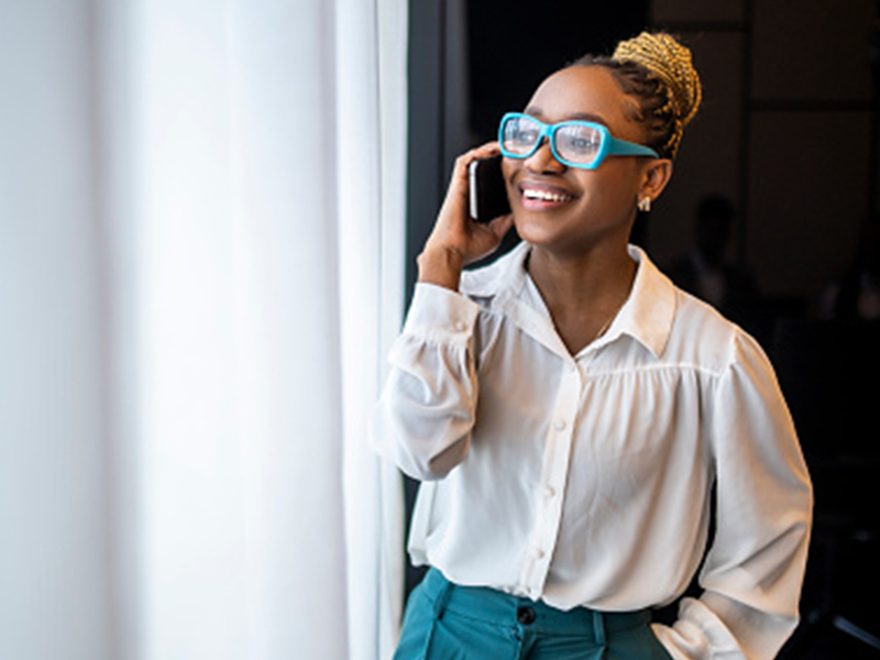 Woman talking on phone with FTC Unlimited Plan